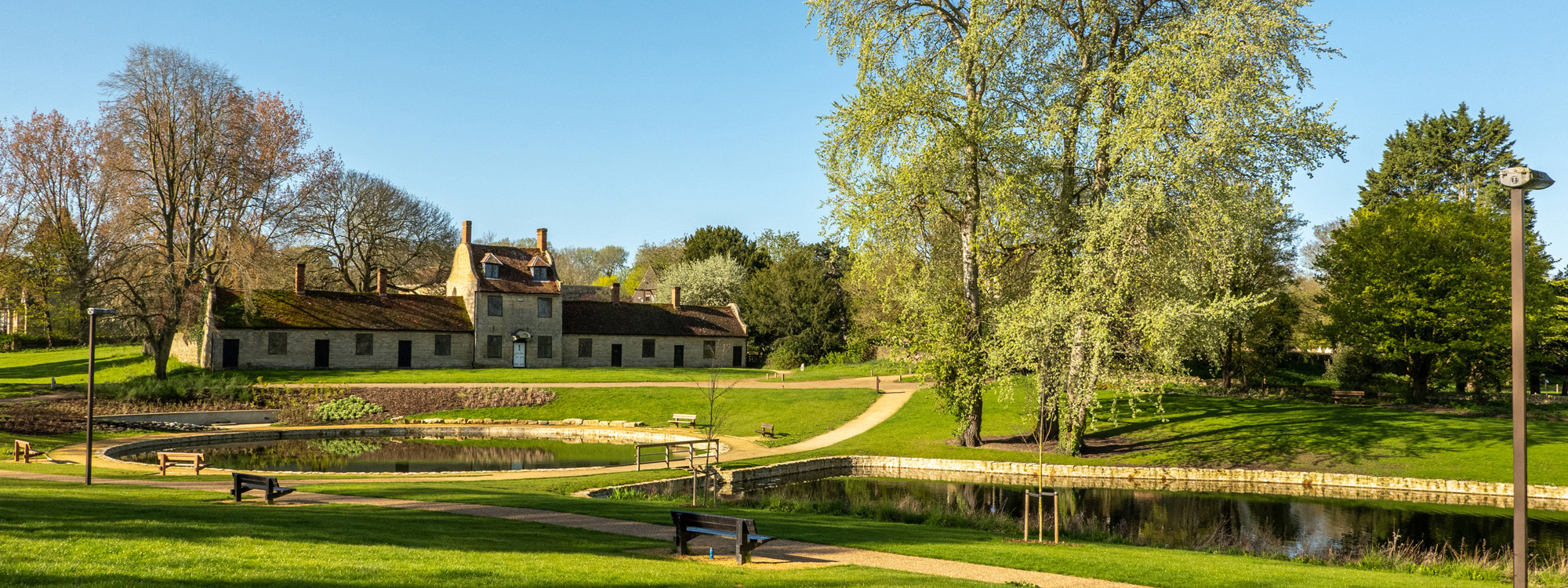 Stone building and ornamental lakes at Great Linford Manor Park.