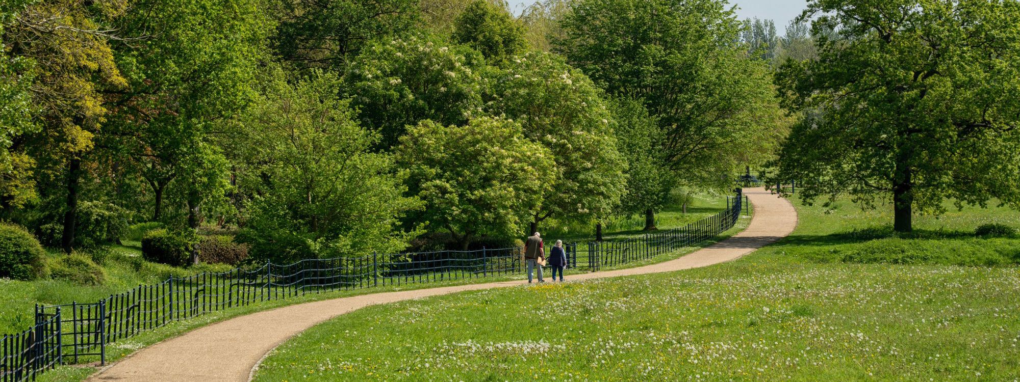 Campbell Park pathway with two people walking in the distance