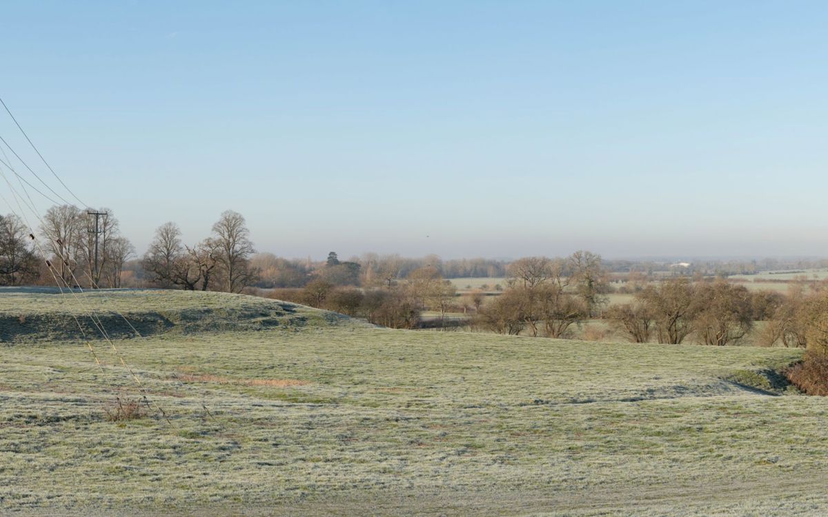 Grass area showing earth works of Bailey