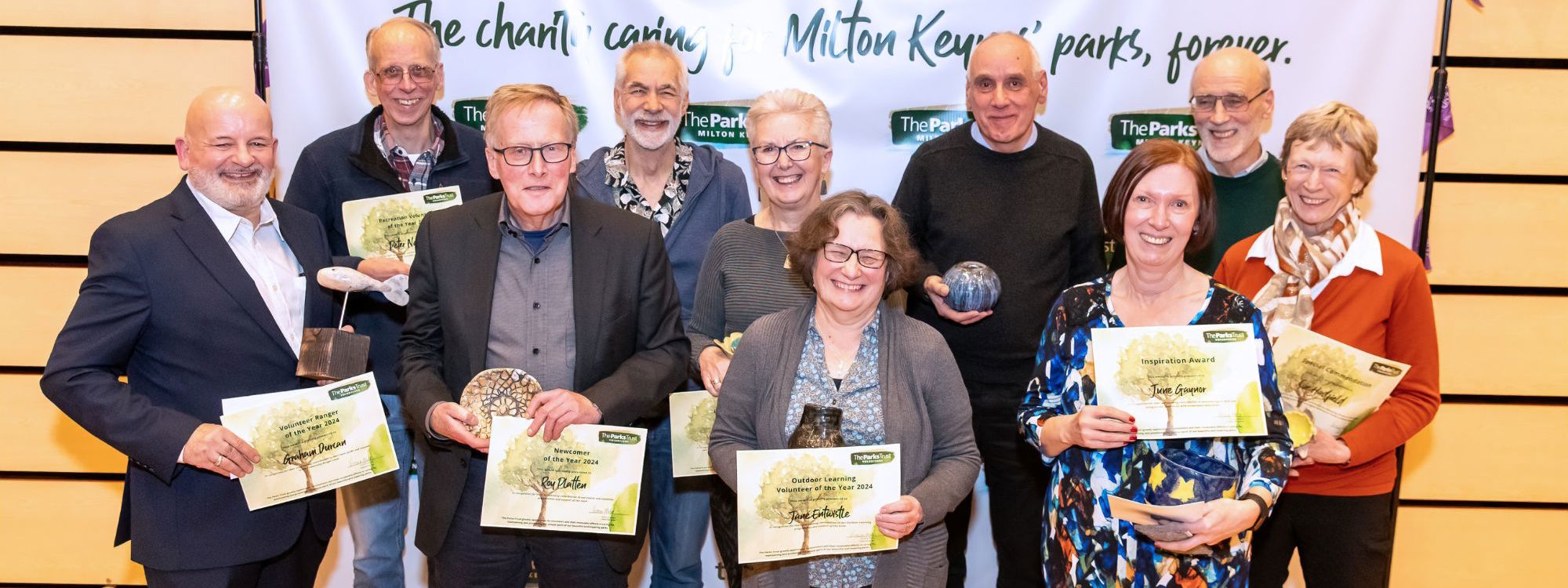 Group of Parks Trust volunteers holding their certificates