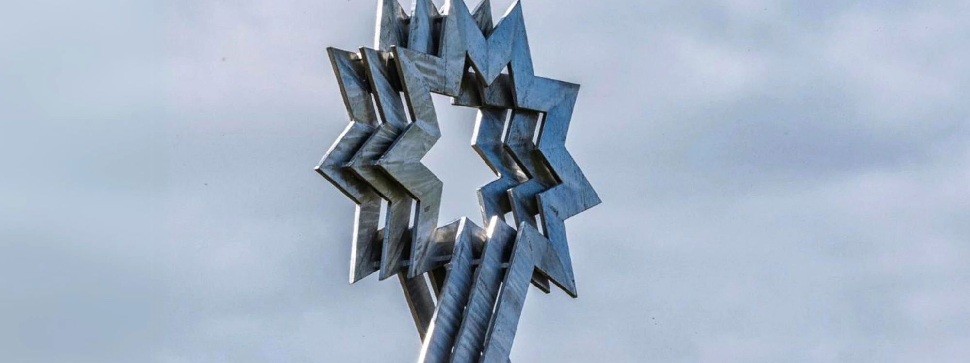 metal star figure placed against a sky backdrop