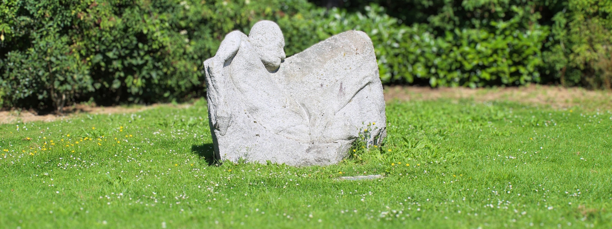 a large stone with a person carved into it