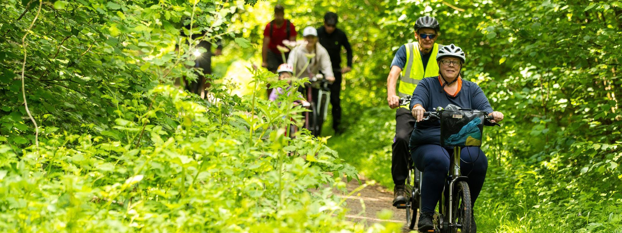 Group of cyclists on a bike round around Milton Keynes park