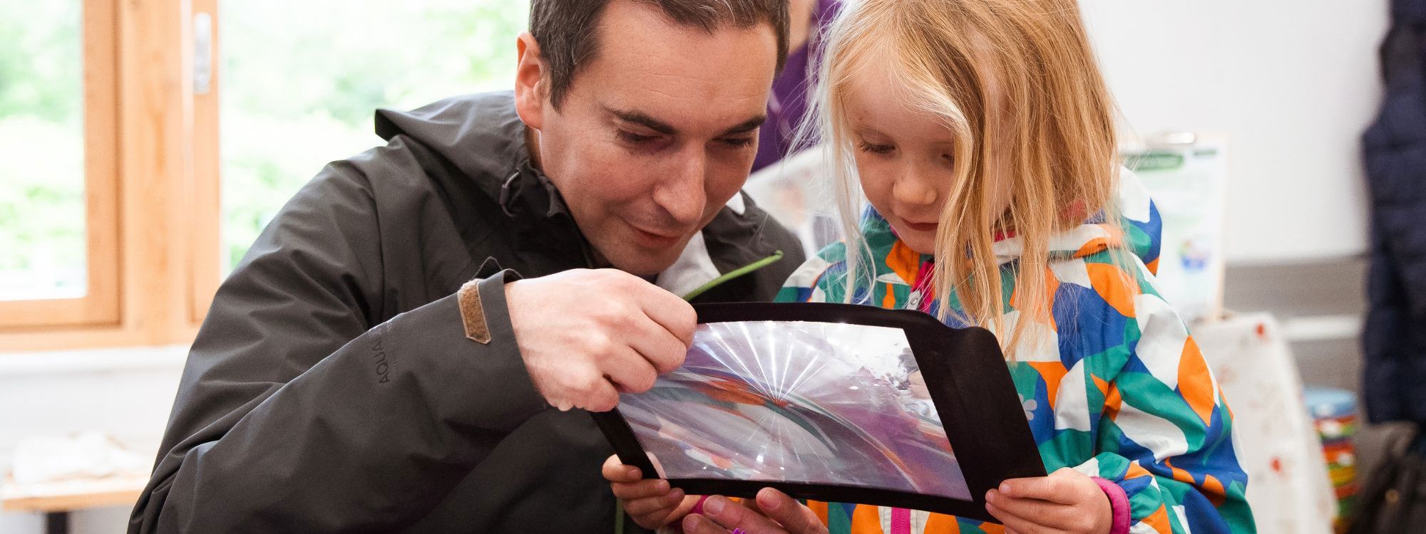 Child doing indoor activity with parent