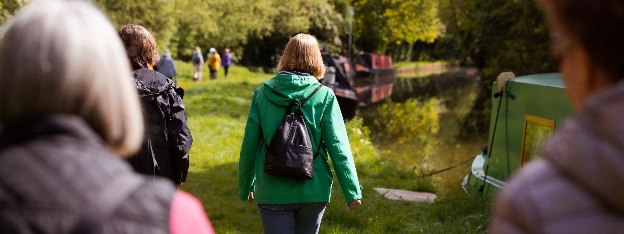 Group of women walking alongside the canal