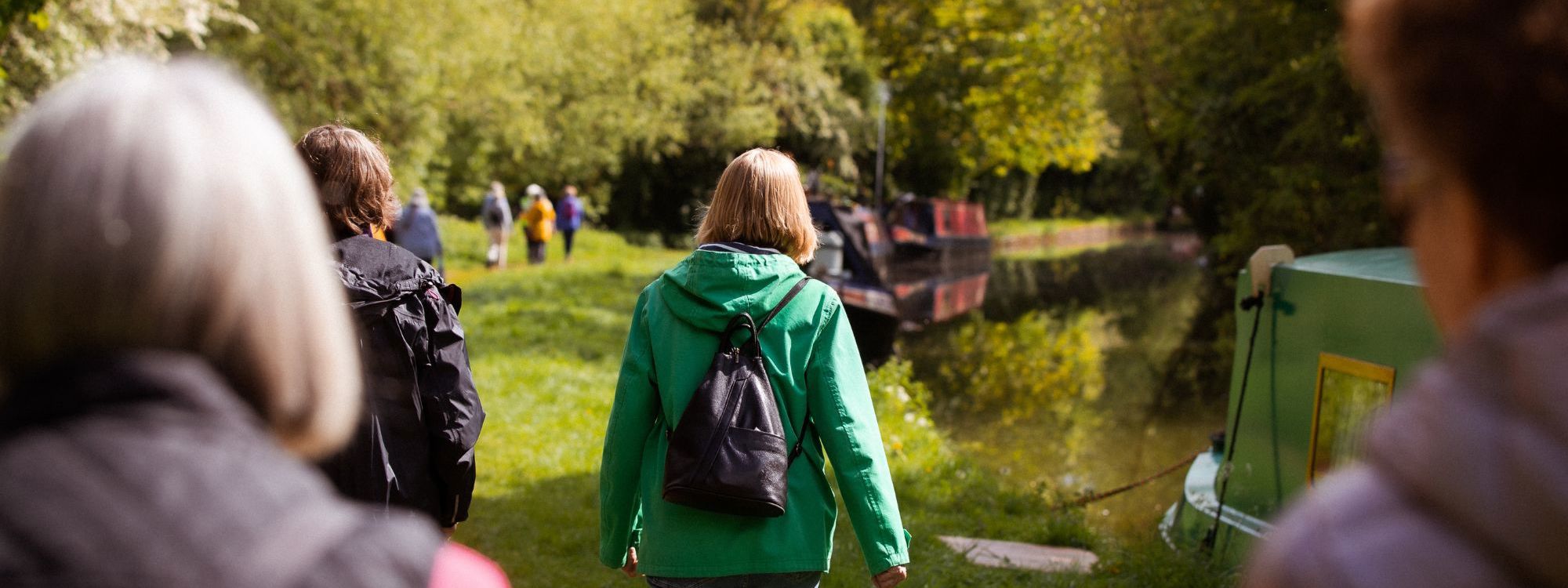 Group of women walking alongside the canal