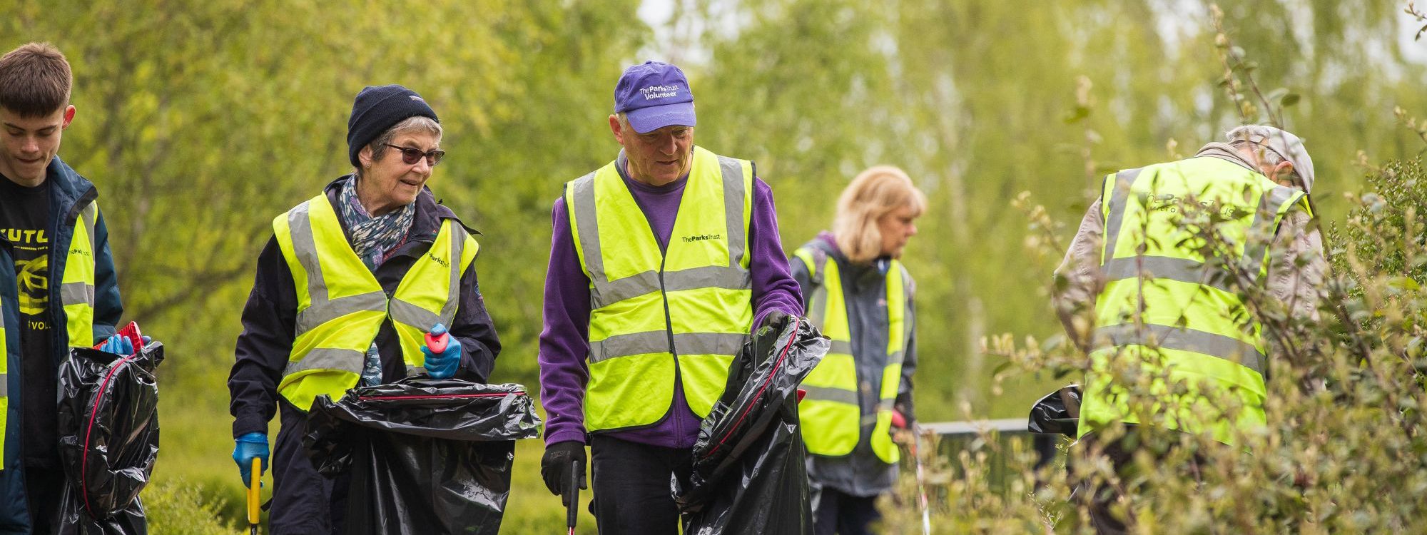 Group of people doing a litter pick in Milton Keynes park