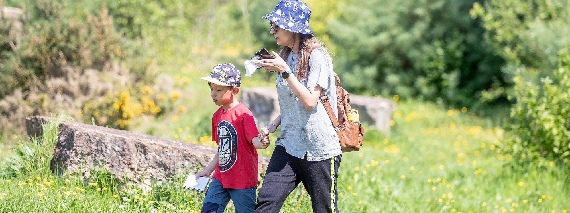 Parent and child walking in the park