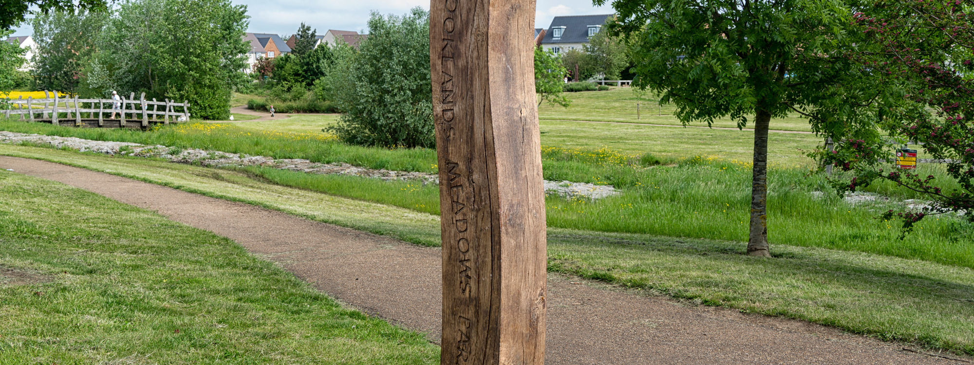 Brooklands Meadow park sign and footpath.