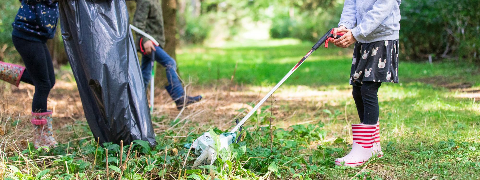 Children picking up litter from a park
