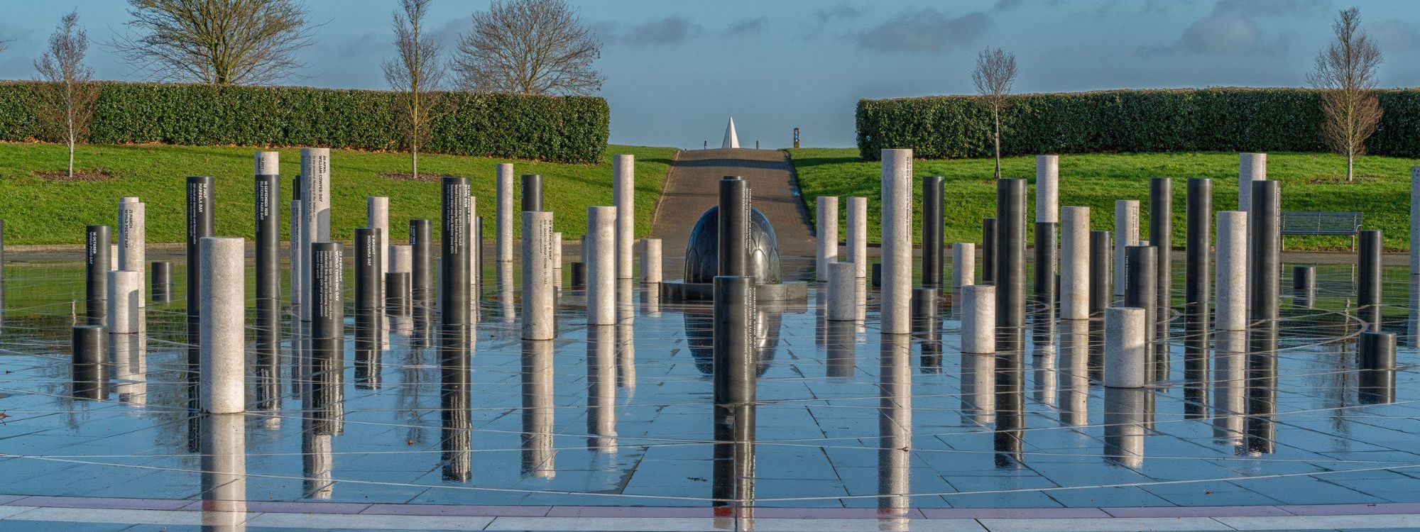 Milton Keynes Rose sculpture with black and white pillars