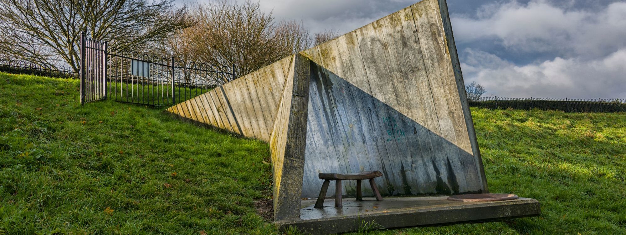 Wooden sculpture with stool in Campbell Park in Milton Keynes